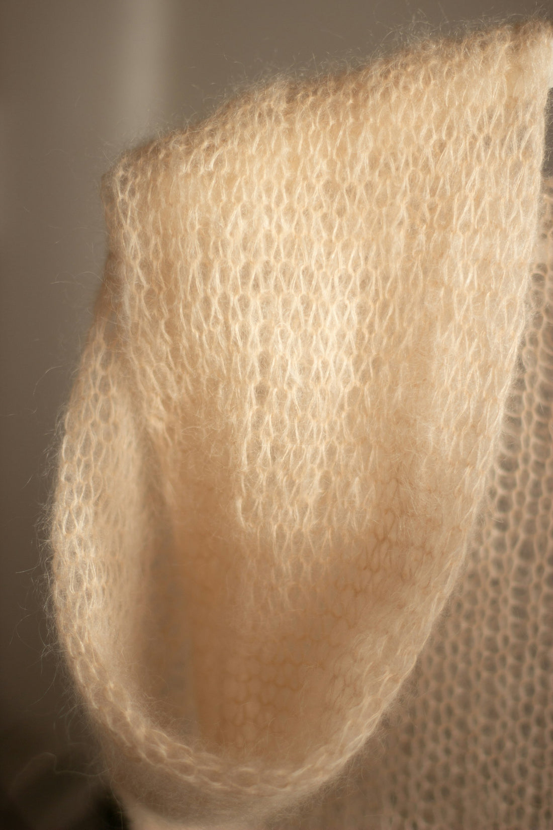 Close-up of delicate knit fabric — how to spot a quality sweater